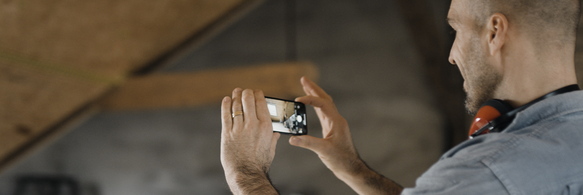 Contractor Taking Photo For Social Media Marketing